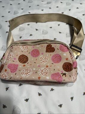 Women’s Beige Crossbody Belt Bag with Mexican concha design.